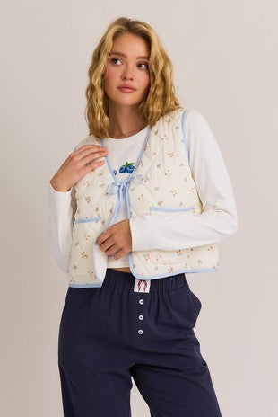 Floral vest with blue trim