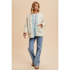 Reversible quilt jacket with floral or checkered