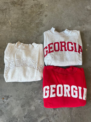 Grey crewneck with red writing